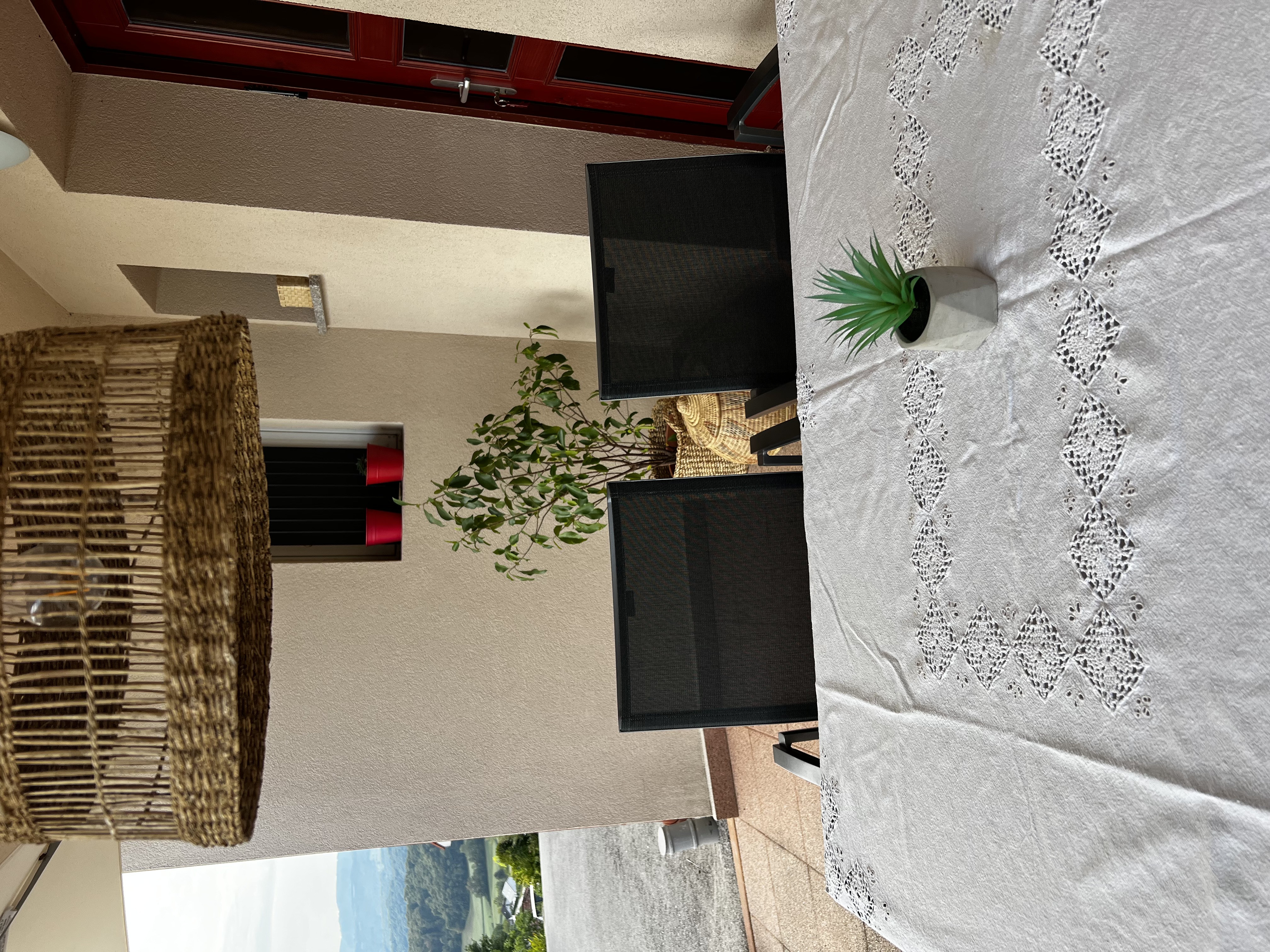 Terrace with dining table and valley views